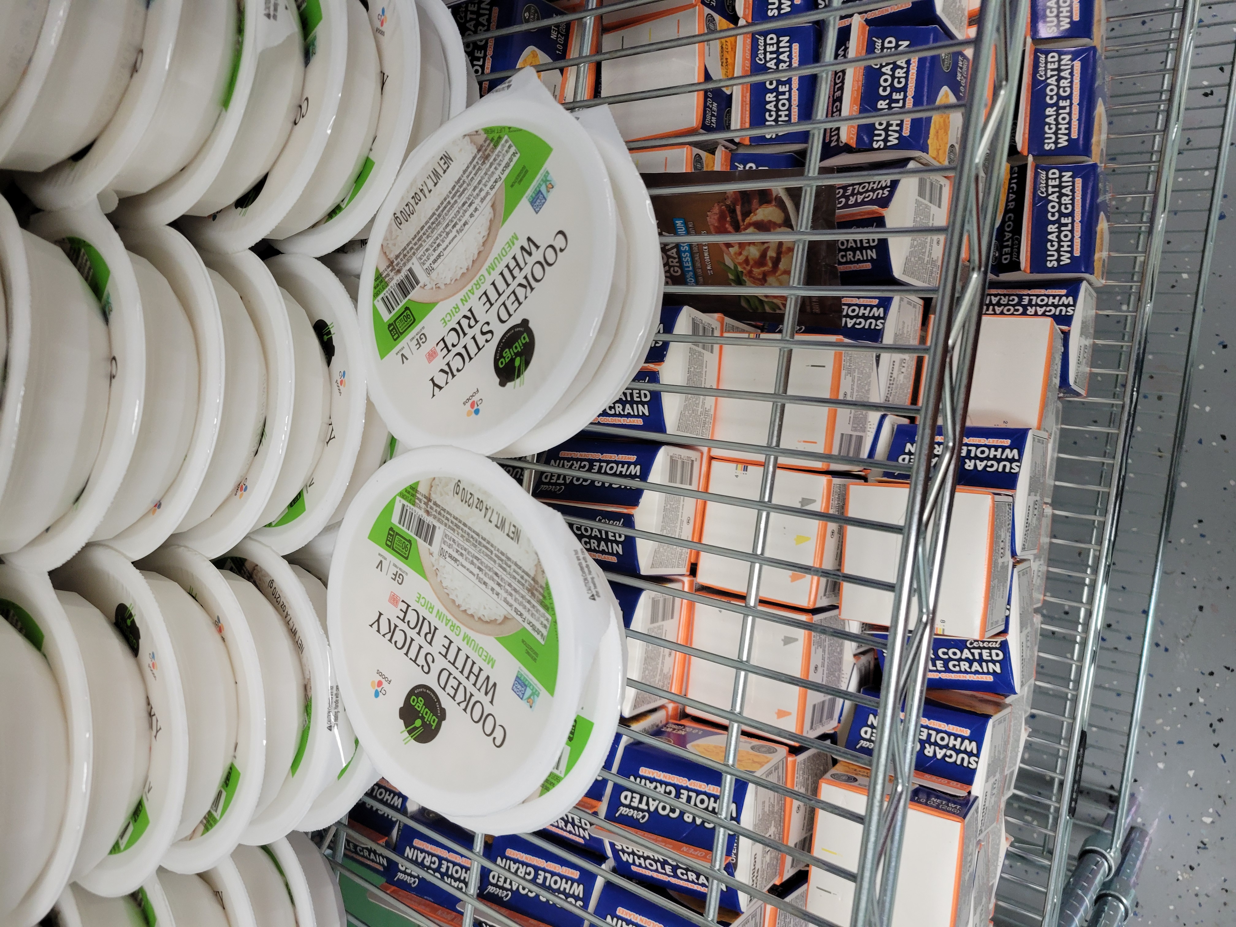 Plastic bowls of cooked sticky white rice.